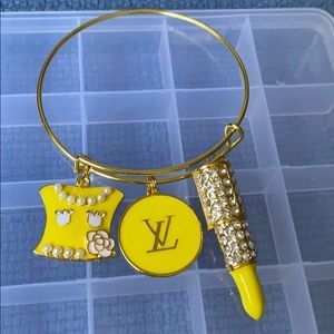 Gold plated bangle with charms